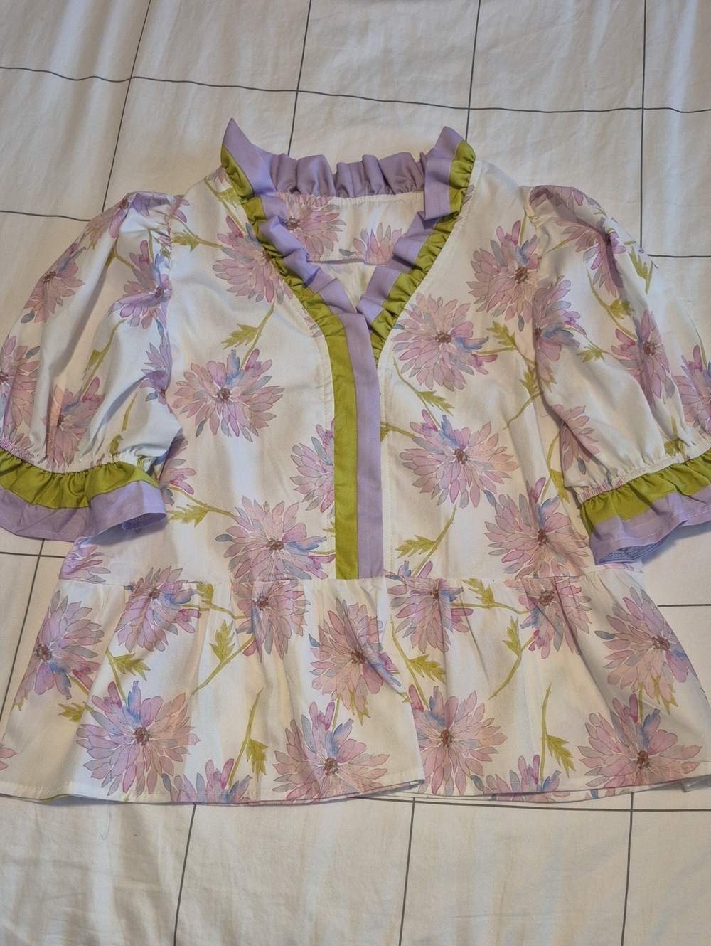 Red Dress Boutique Lavender Floral Ruffle Peplum Top with Green Trim